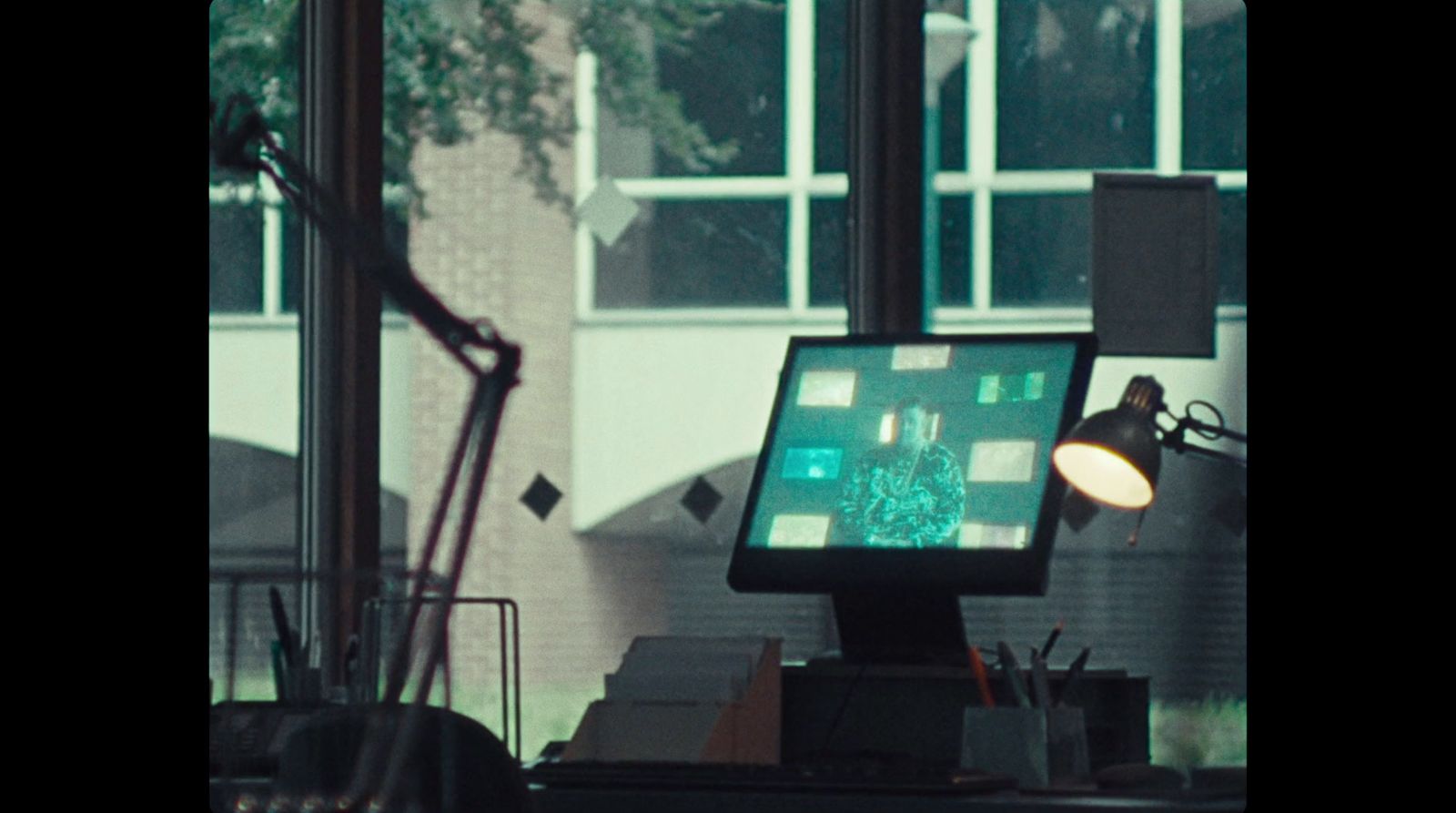 a computer monitor sitting on top of a desk