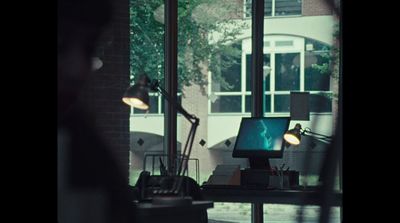 a computer monitor sitting on top of a desk