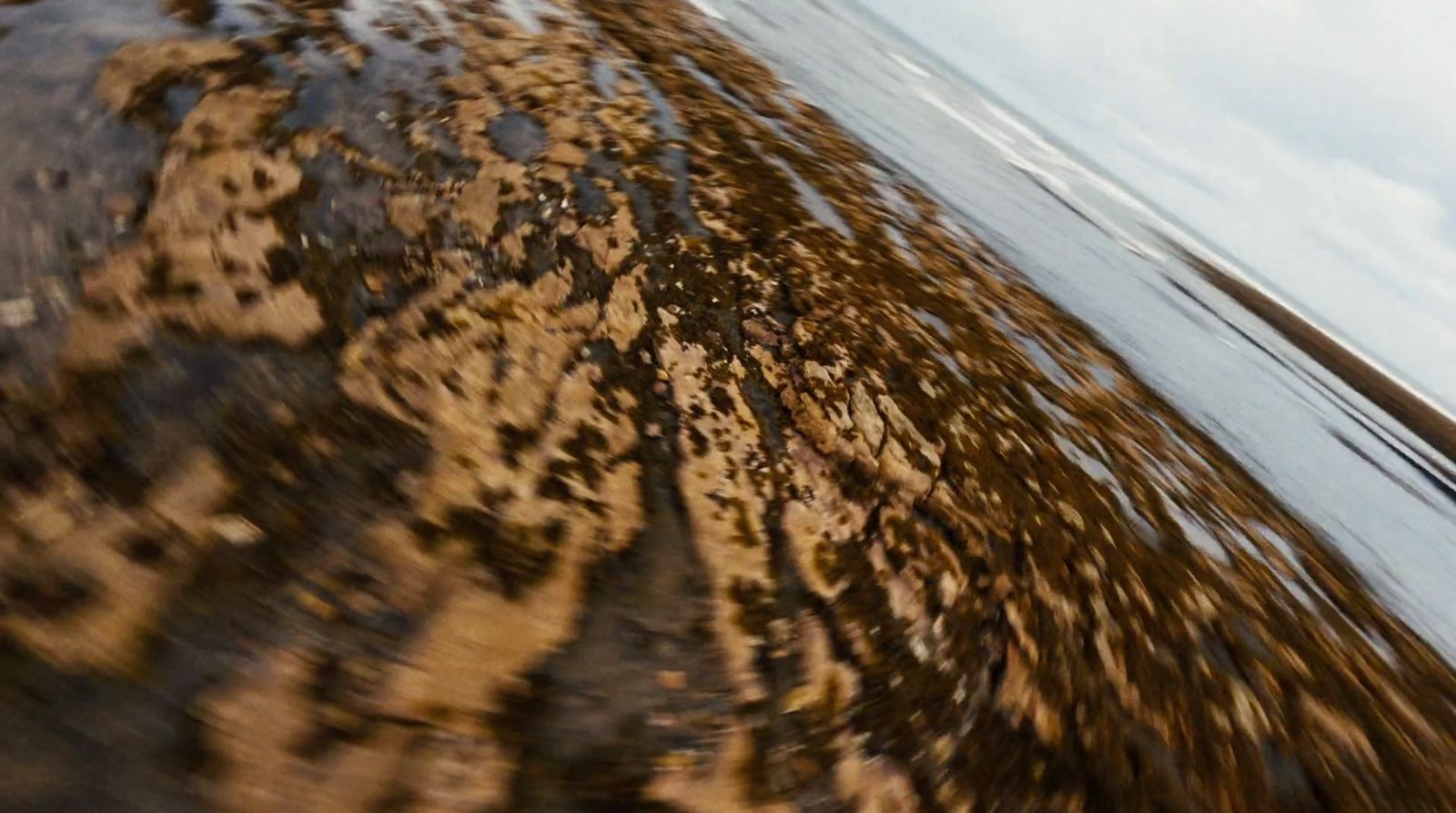 a person riding a surf board on a body of water