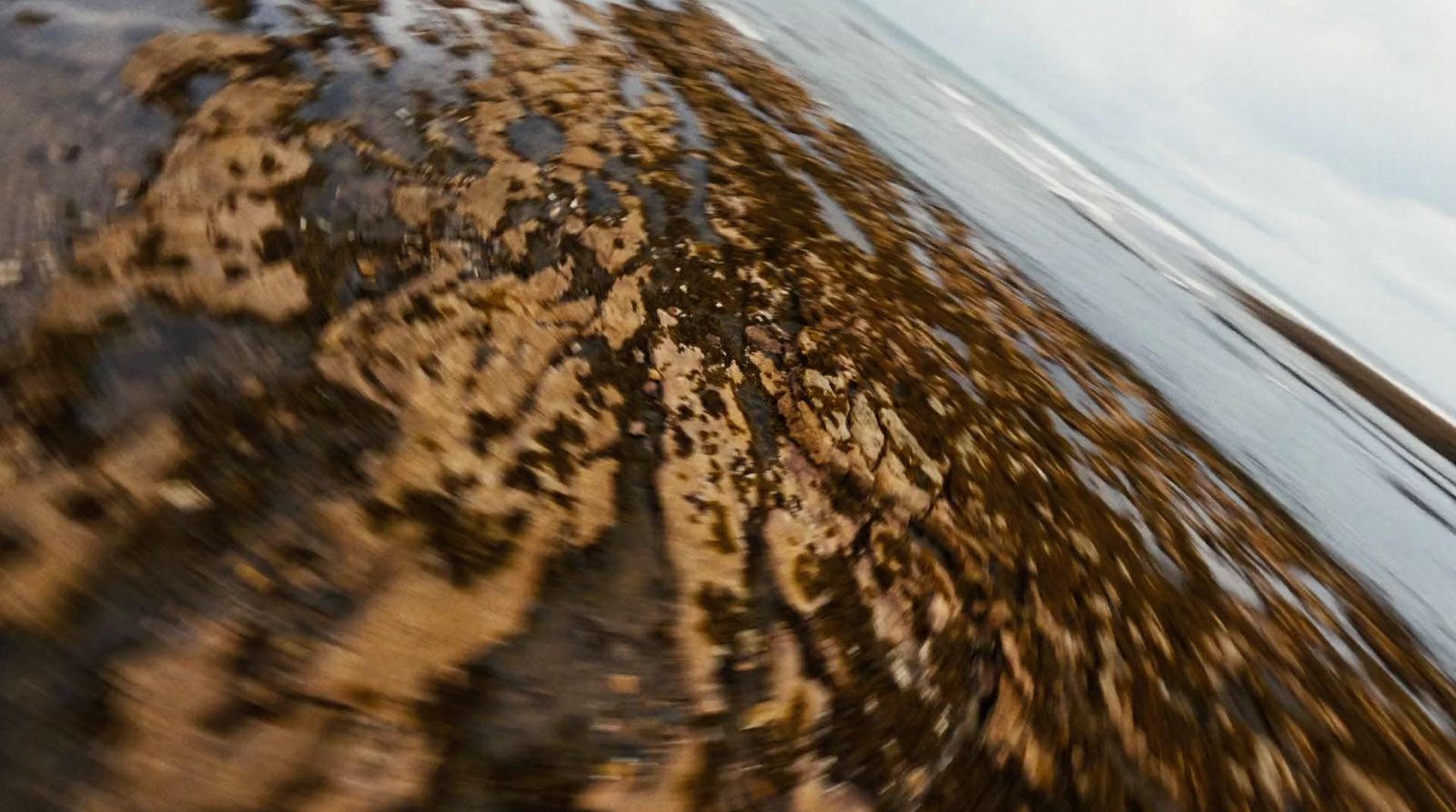 a person riding a surf board on a body of water