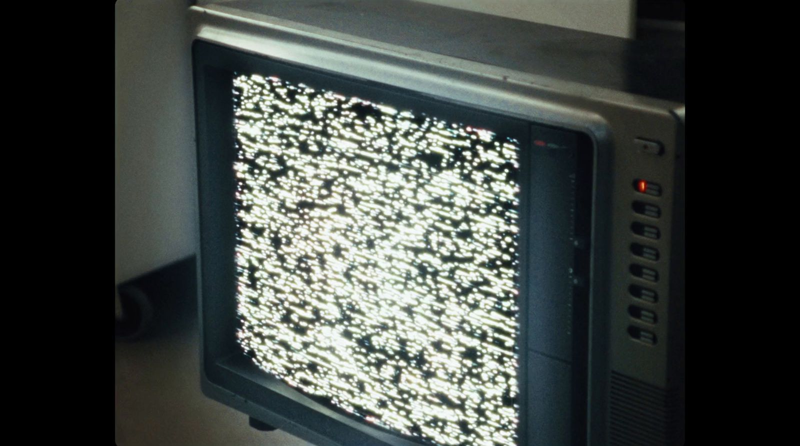 an old television with a lot of white dots on it