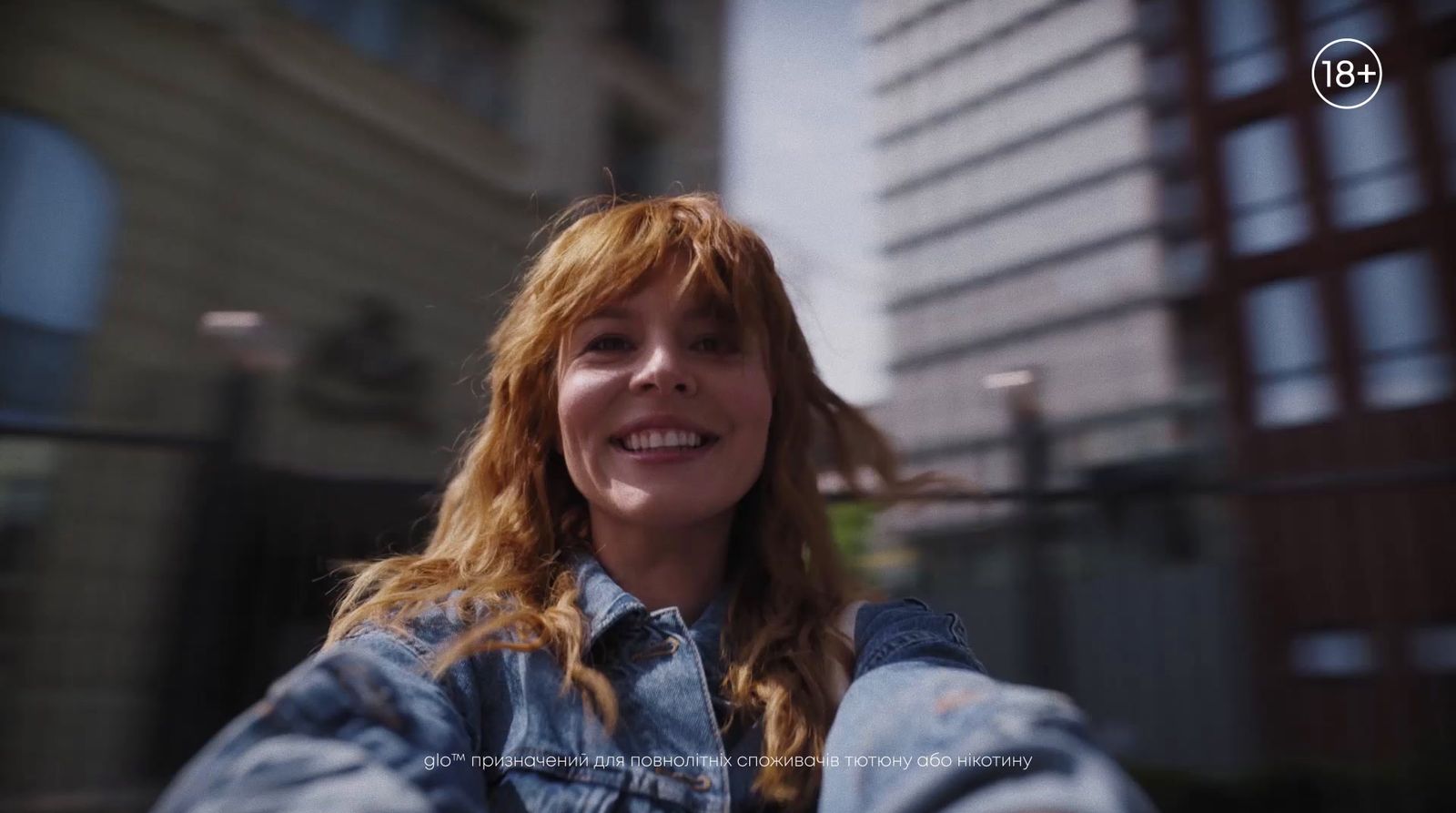 a woman with red hair is taking a selfie