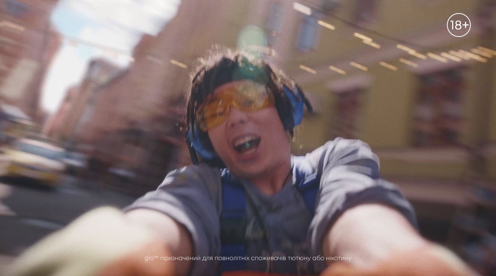 a blurry image of a person wearing headphones