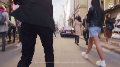 a blurry photo of people walking down a street