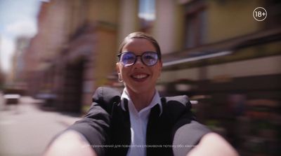 a woman wearing glasses taking a selfie