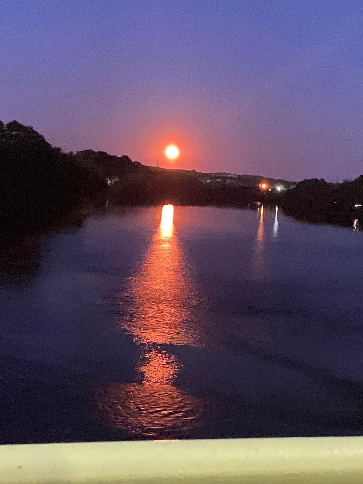 the sun is setting over a body of water