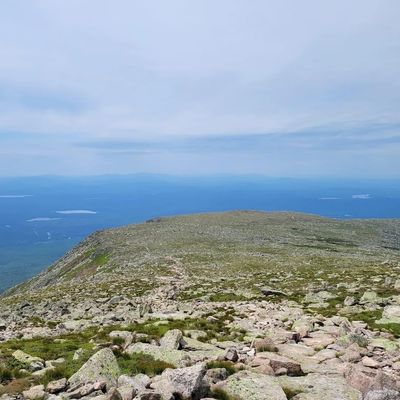 a view of the ocean from the top of a mountain