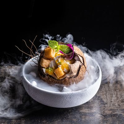 a plate of food with smoke coming out of it