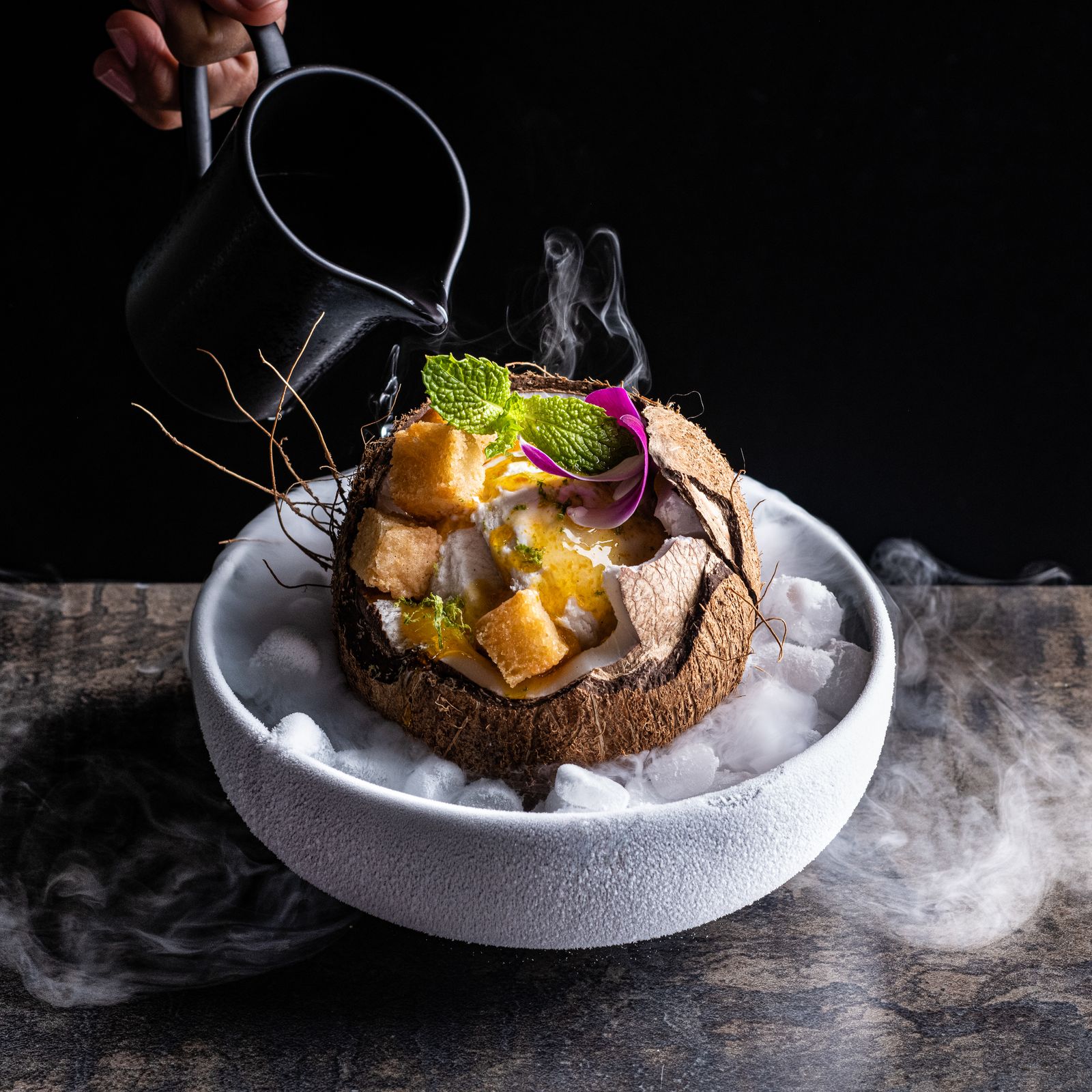a bowl of food with smoke coming out of it