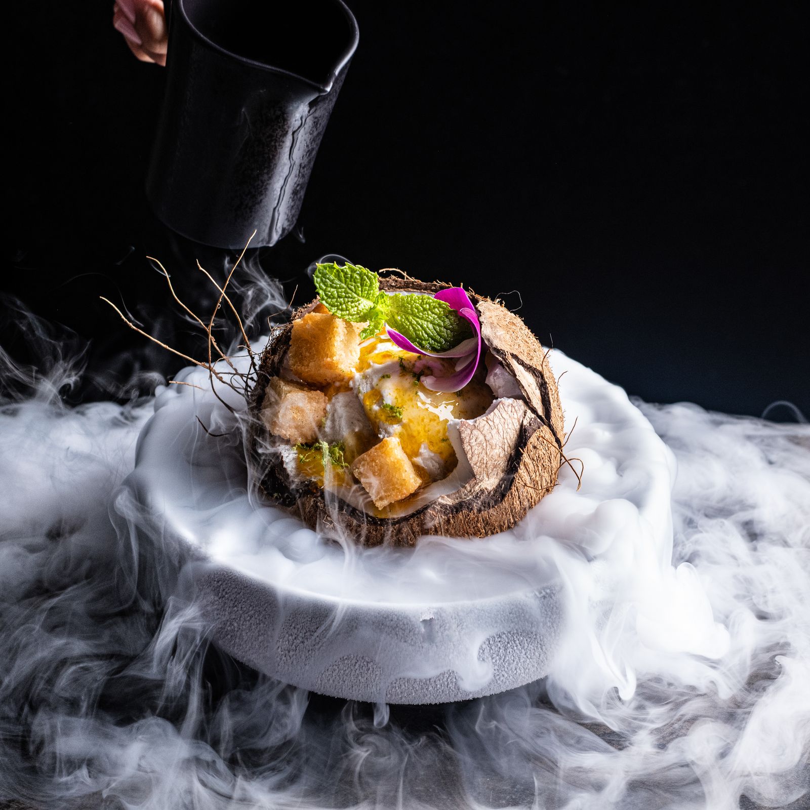 a plate of food with smoke coming out of it