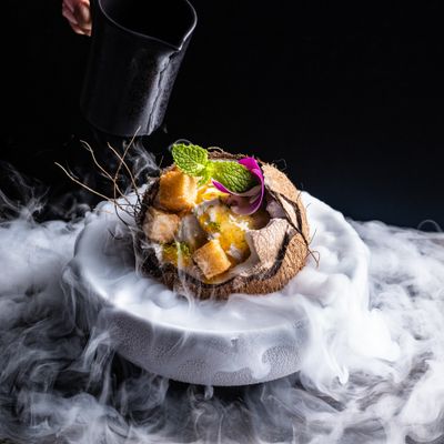 a plate of food with smoke coming out of it