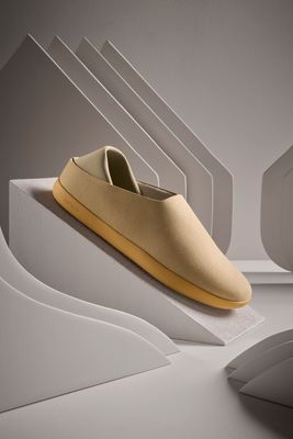 a pair of shoes sitting on top of a white surface