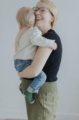 a woman holding a child in her arms