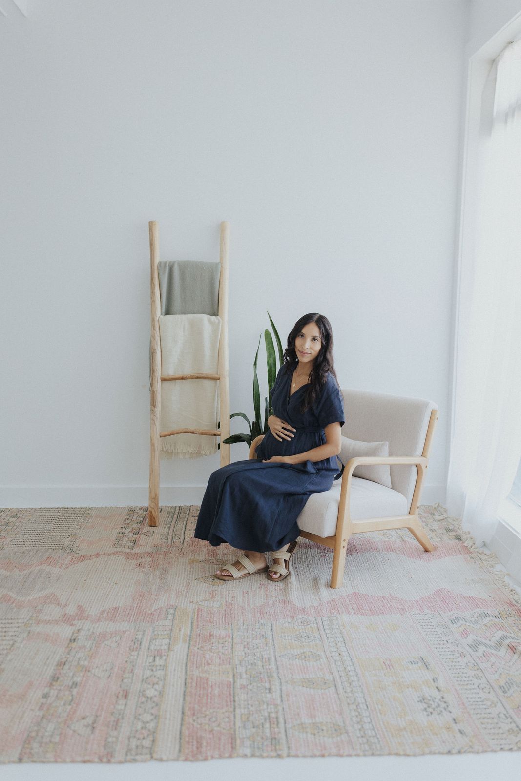 a woman sitting in a chair in a room