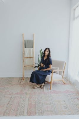 a woman sitting in a chair in a room