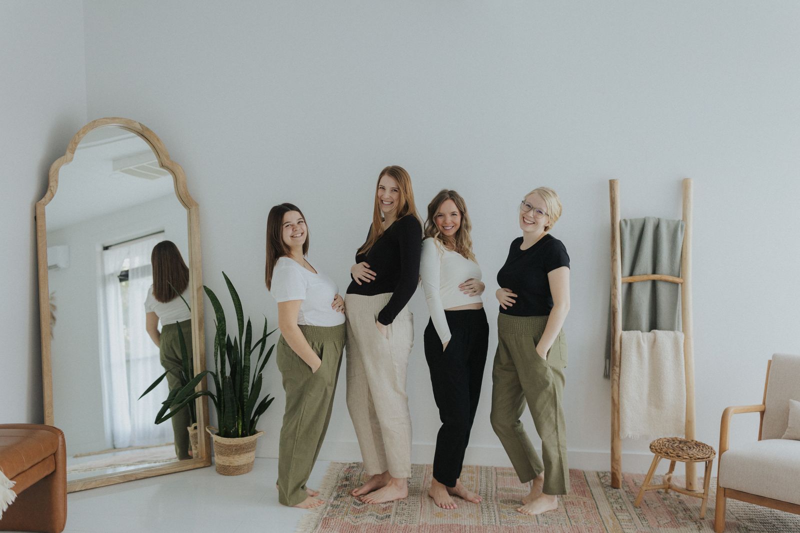 a group of women standing next to each other