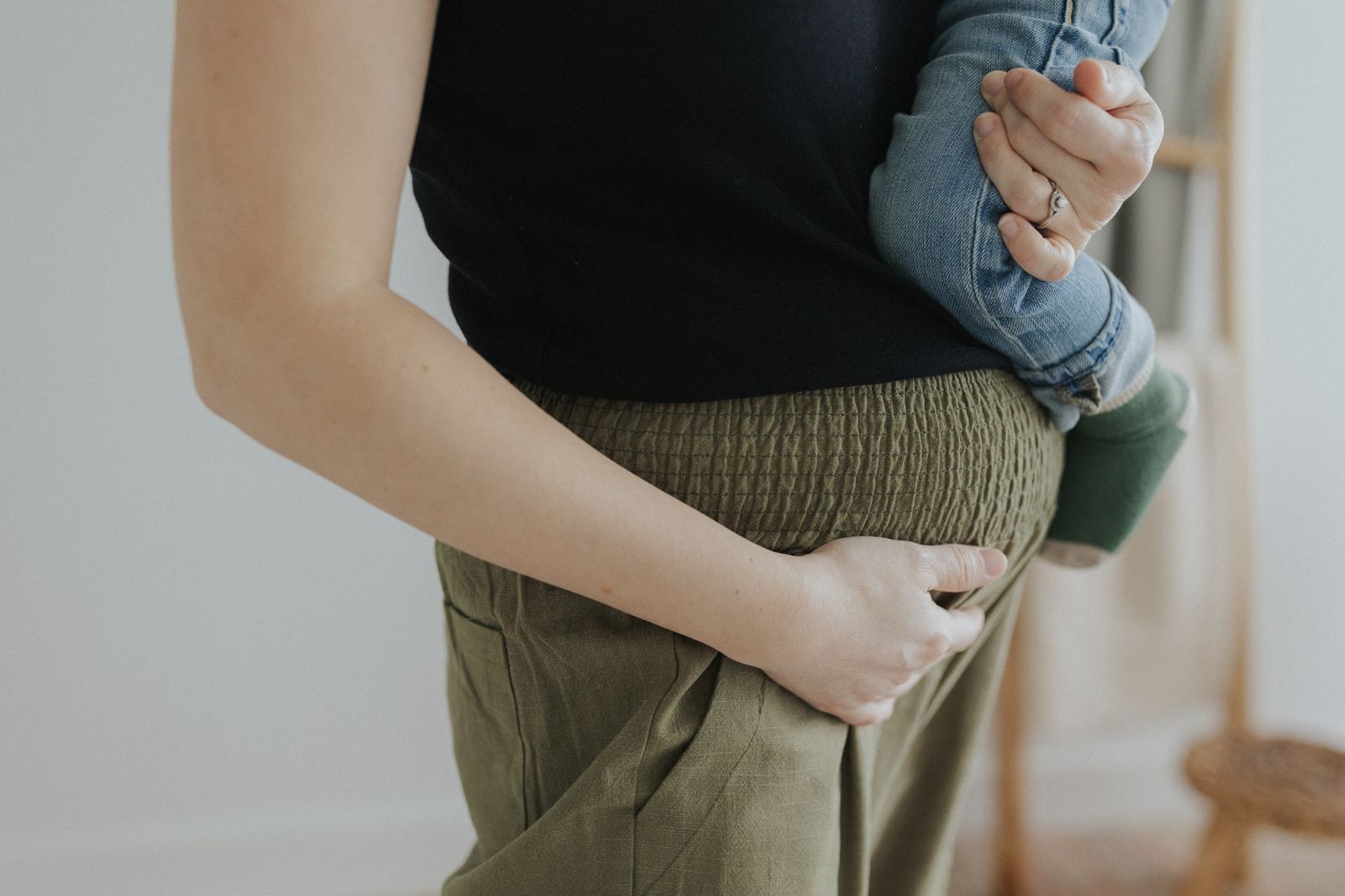 a woman holding a baby in her arms