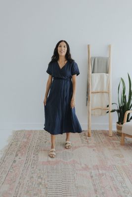 a woman standing on a rug in a room
