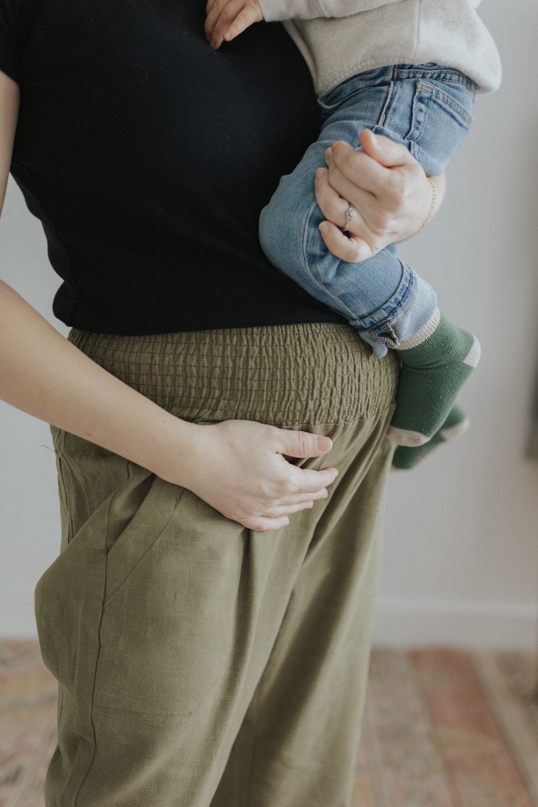 a woman holding a baby in her arms