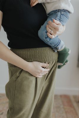 a woman holding a baby in her arms