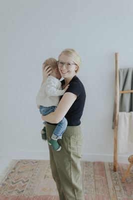 a woman holding a baby in her arms