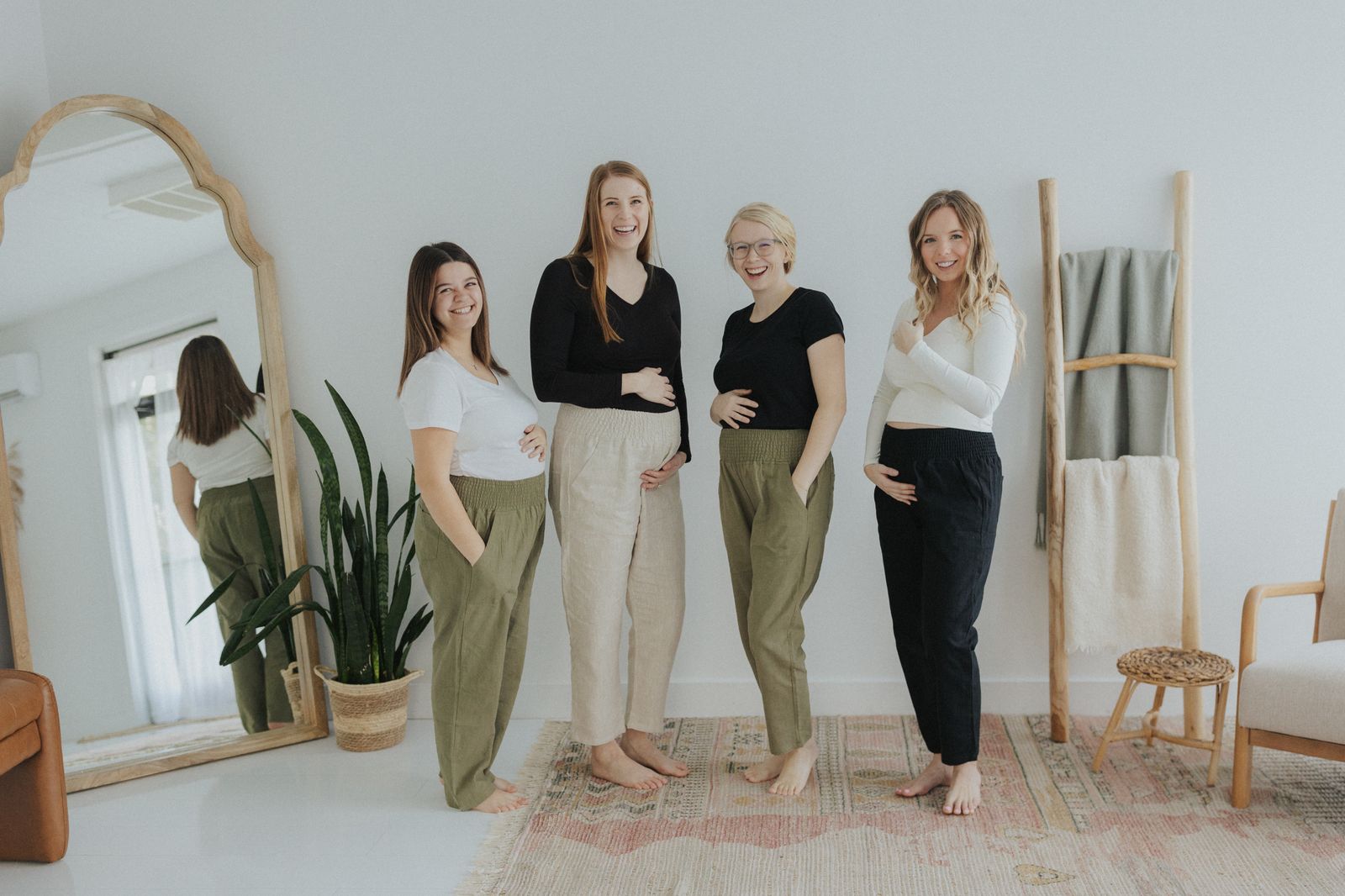 a group of women standing next to each other