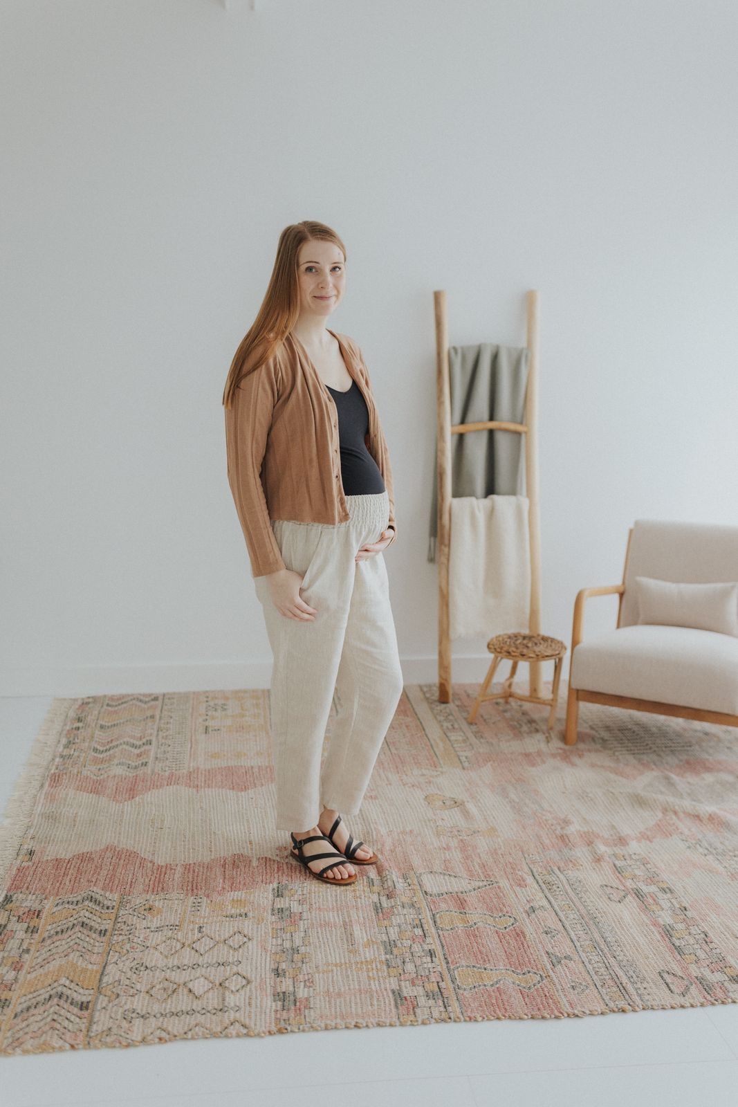 a woman standing on a rug in a room