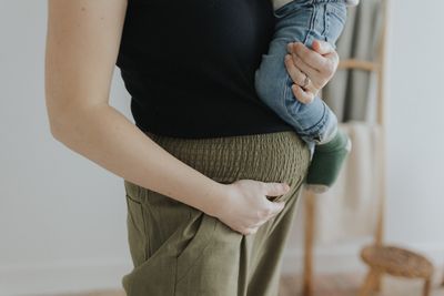 a woman holding a baby in her arms