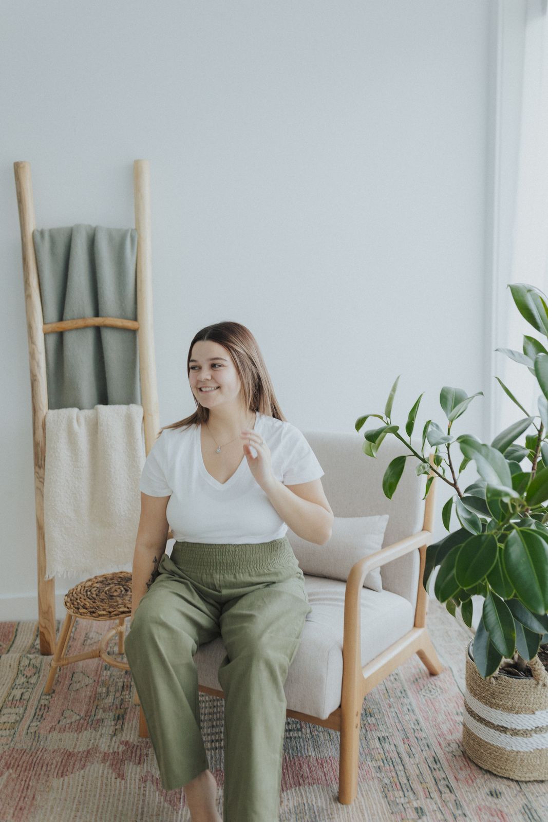 a woman sitting on a chair in a room