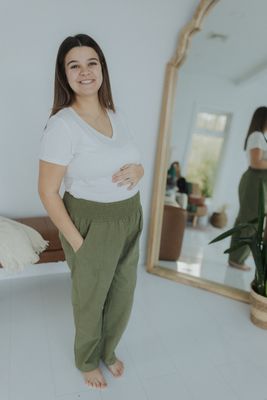 a woman standing in front of a mirror