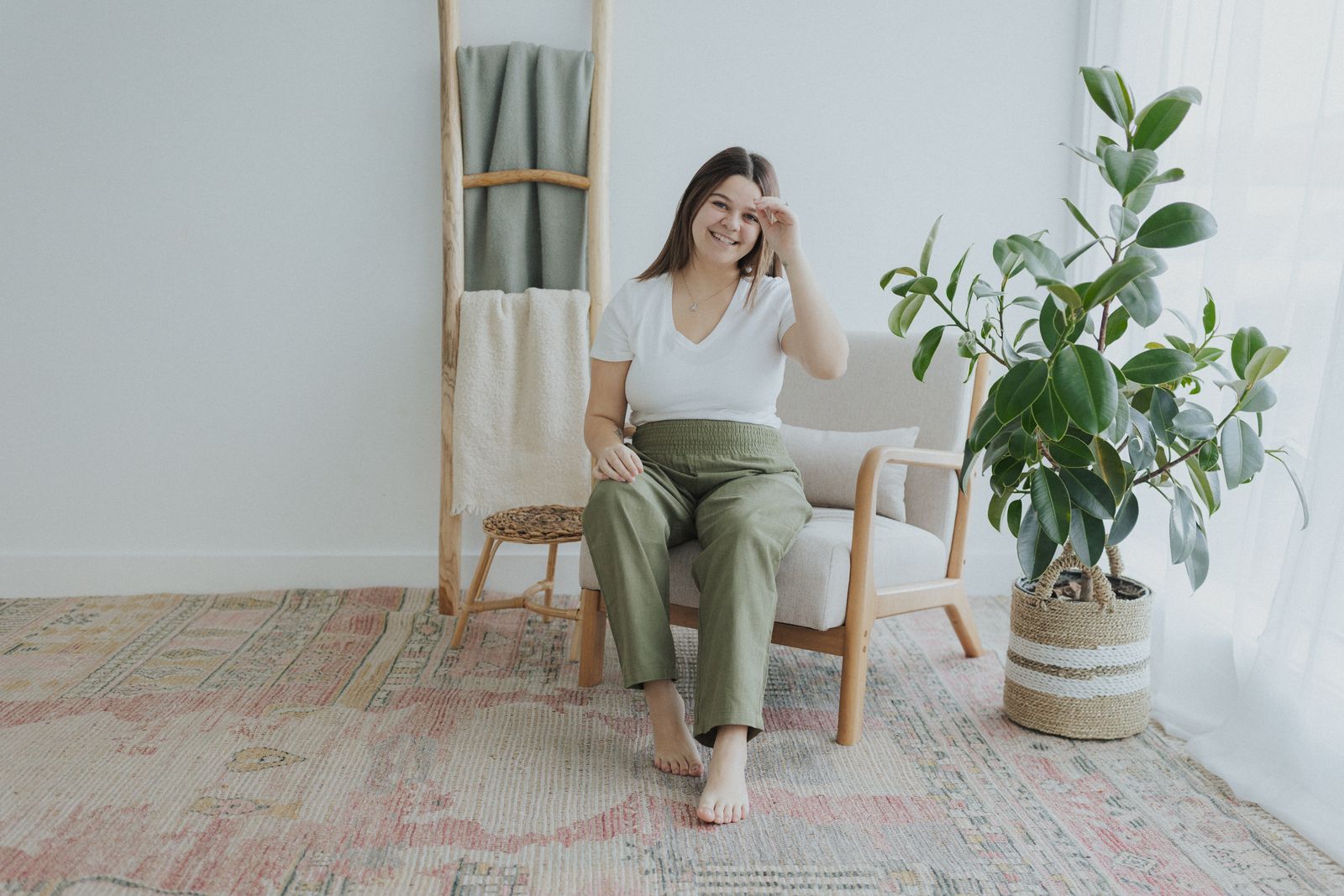 a woman sitting on a chair in a room