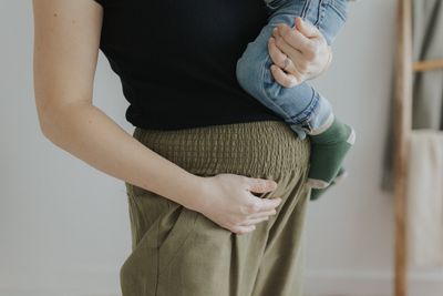 a woman holding a baby in her arms