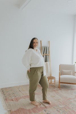 a woman standing on a rug in a room