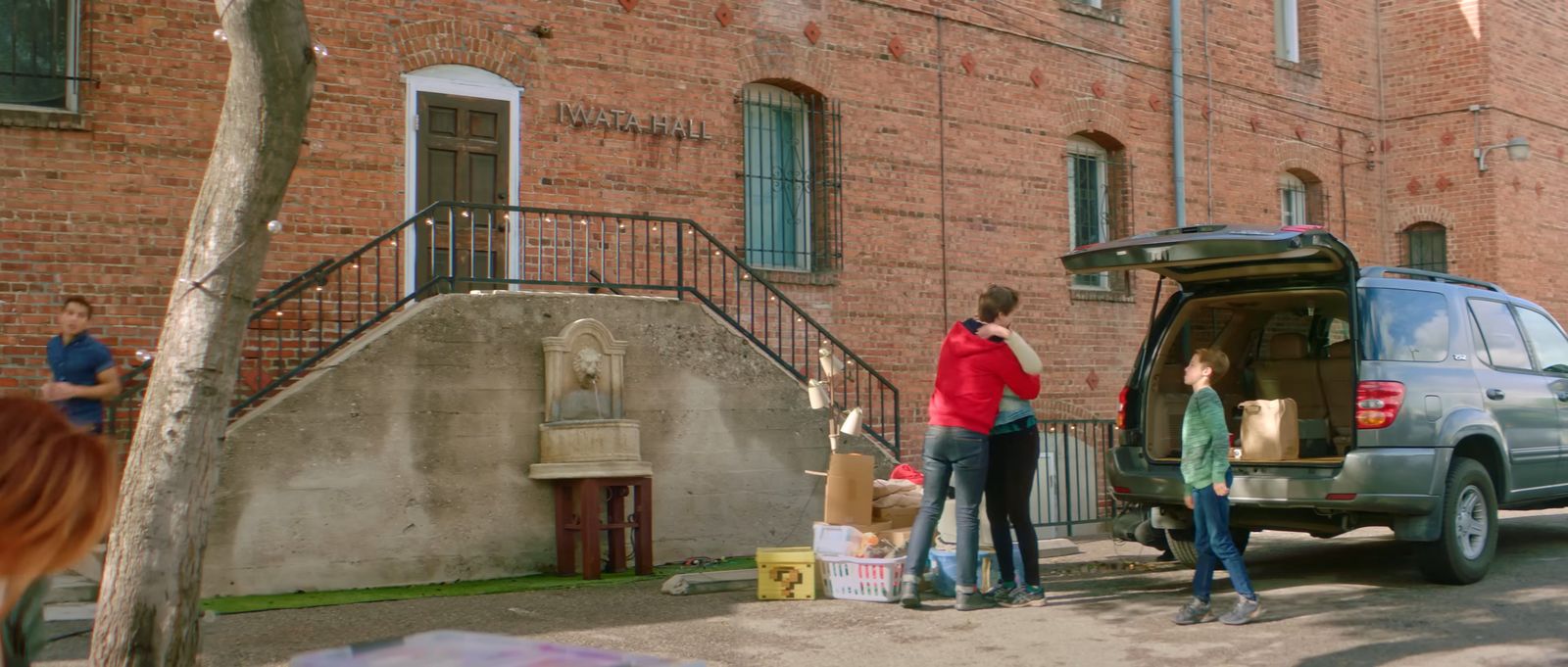 a couple of people standing in front of a van