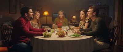 a group of people sitting around a dinner table