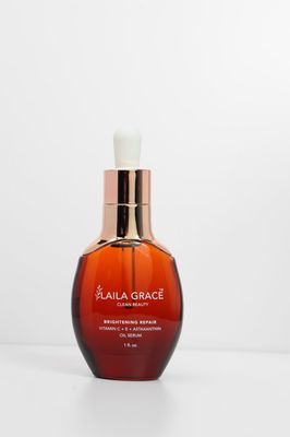 a bottle of liquid sitting on top of a white table