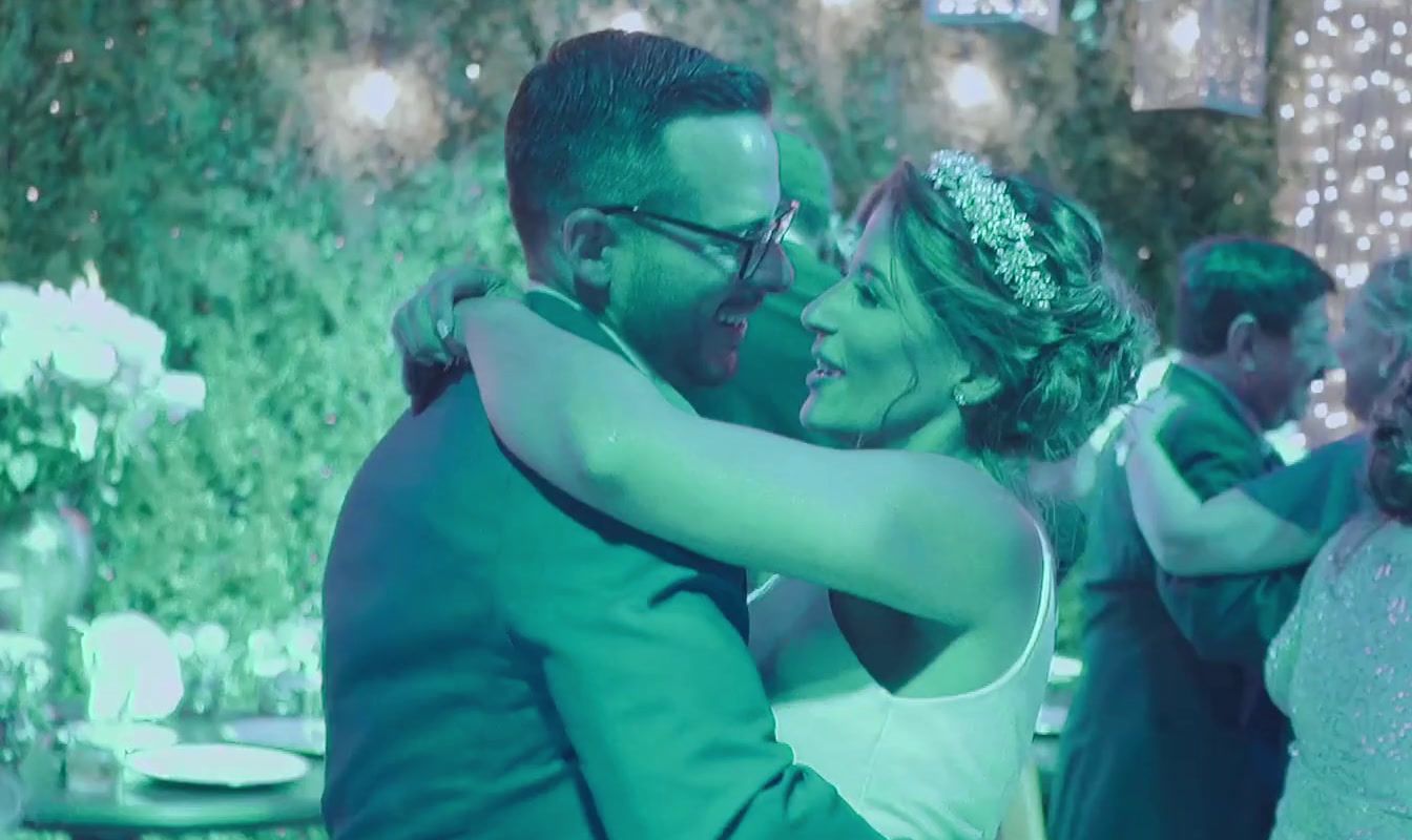 a bride and groom dance together at their wedding reception