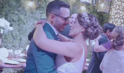 a man and a woman dance together at a wedding