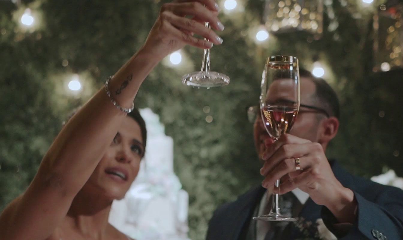 a man and a woman toasting with wine glasses