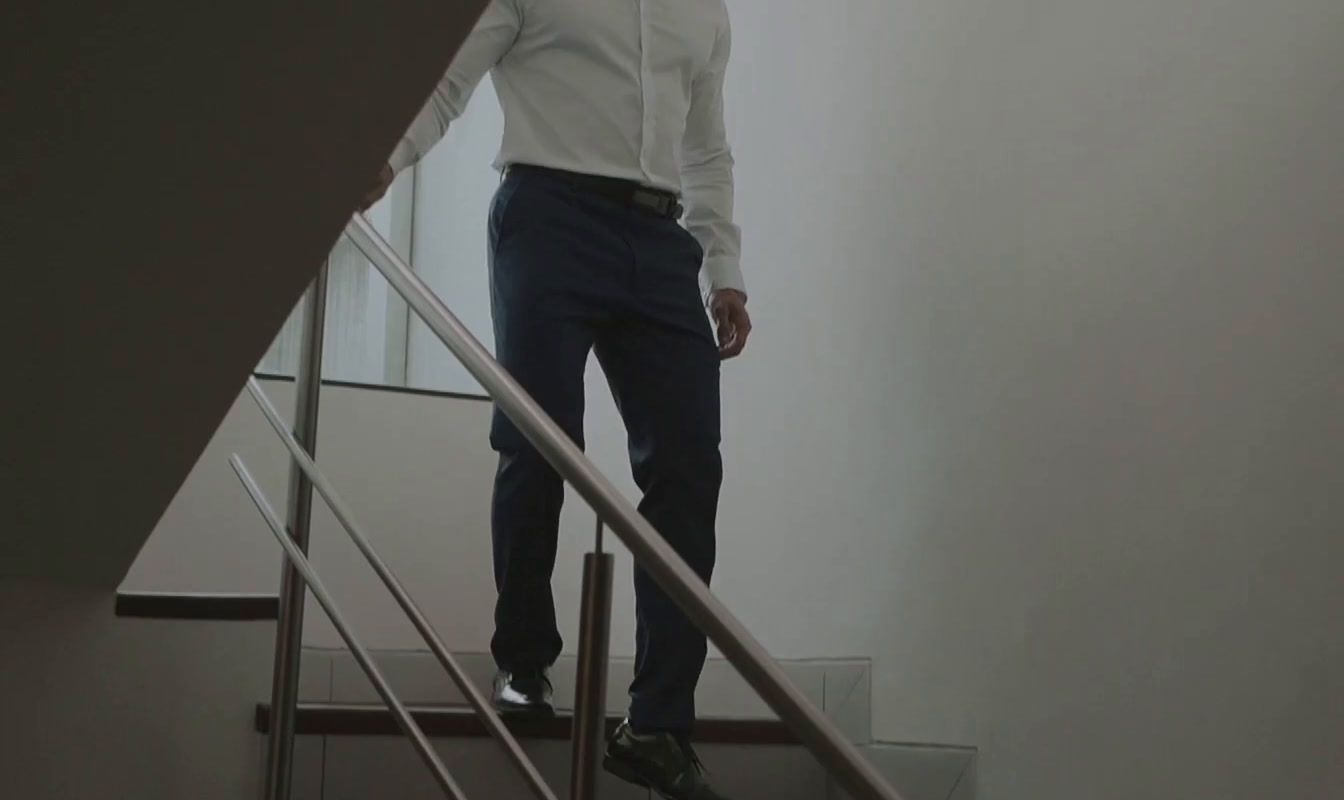 a man is standing on a stair case