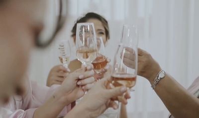 a group of people holding up wine glasses