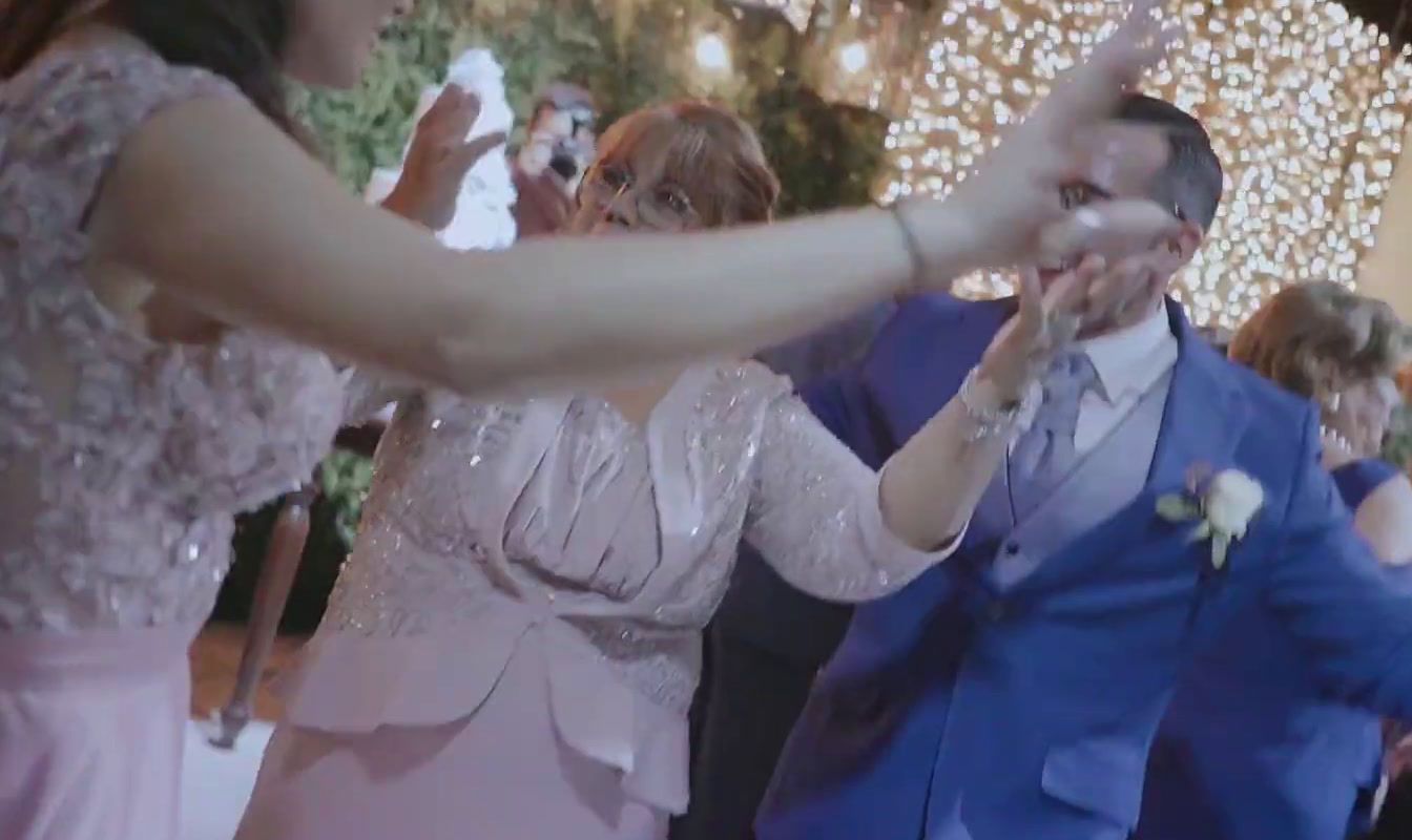 a man and a woman dancing together at a wedding