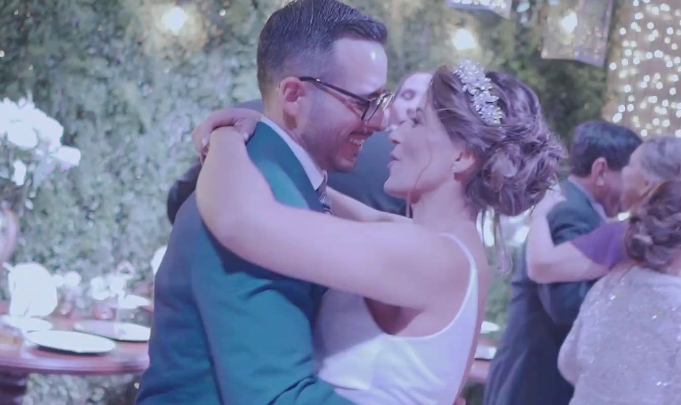 a bride and groom dance together at their wedding reception