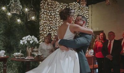 a bride and groom sharing a first dance