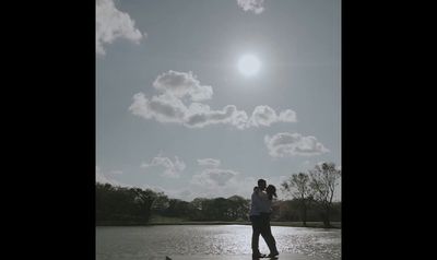 a man riding a skateboard on top of a lake