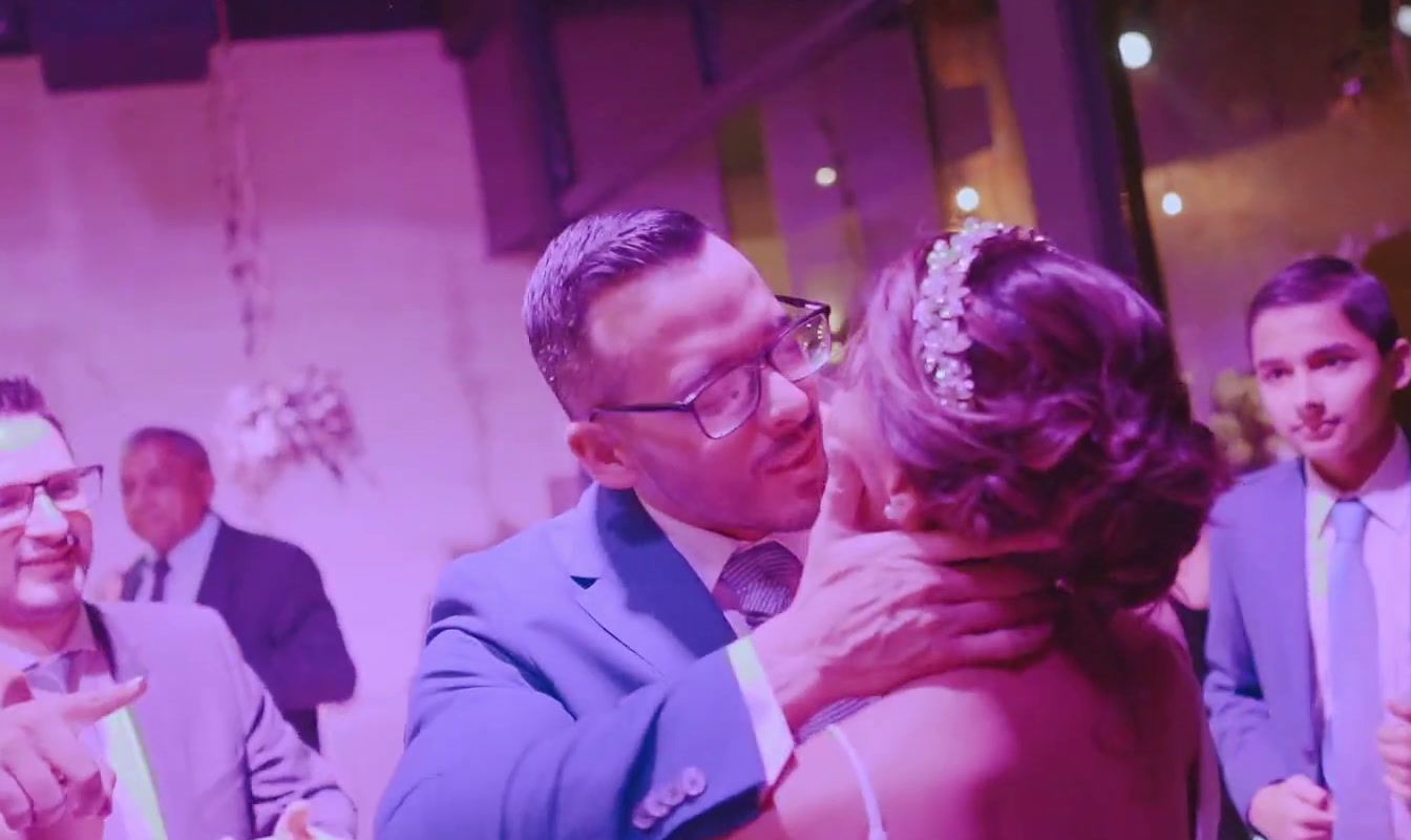 a man and woman sharing a dance at a wedding