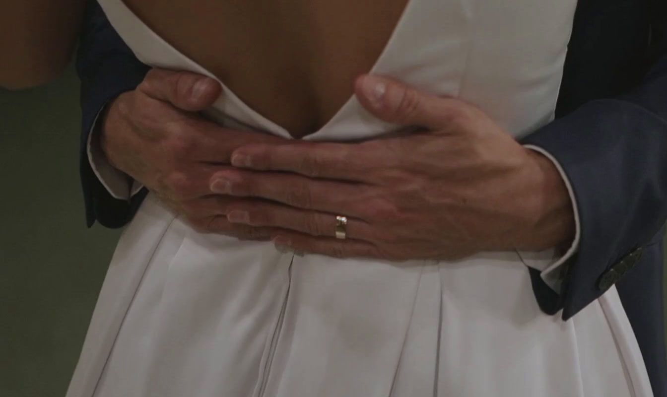 a close up of a person wearing a wedding ring