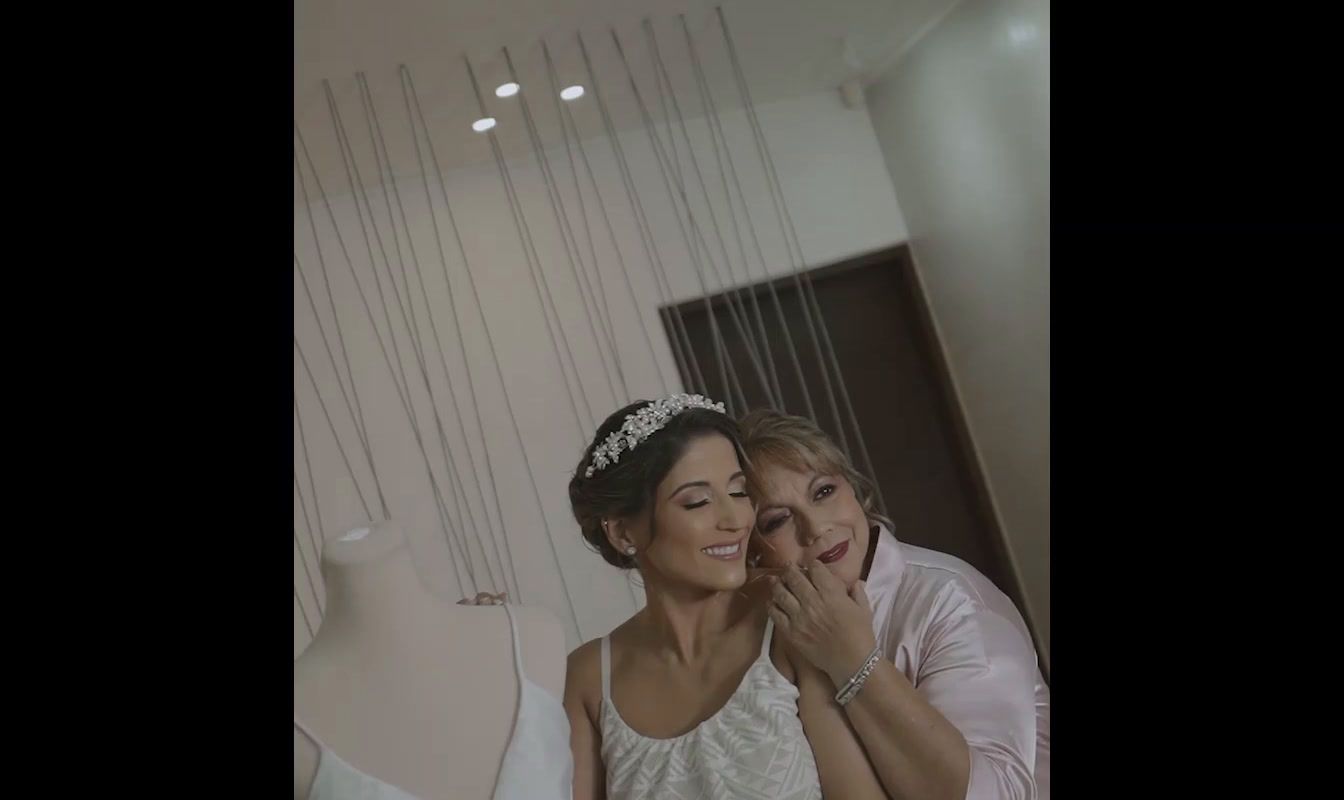 a bride and her mother are posing for a picture