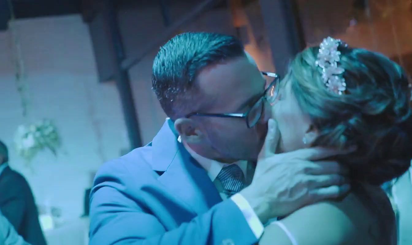 a man and a woman dance together at a wedding