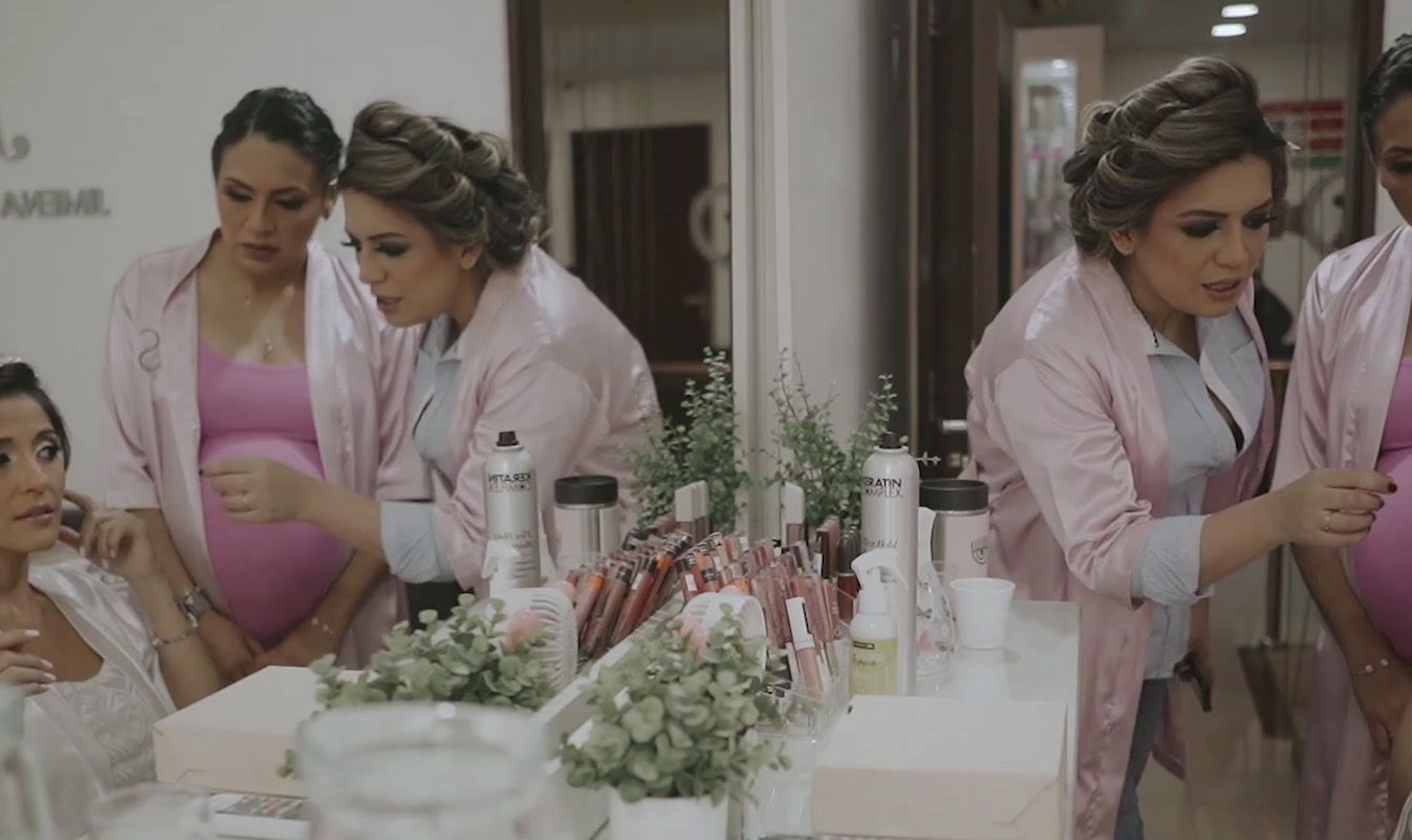 a group of women standing around a table